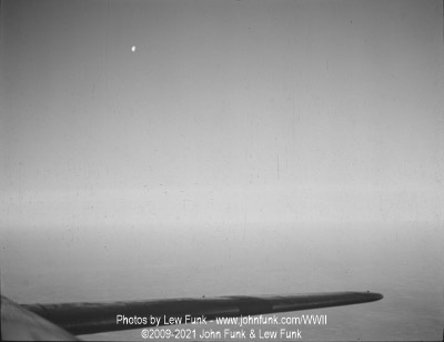 Moon setting over the English Channel on Mission to Berlin February 3, 1945 taken from the Radio Room Top Hatch