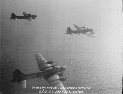B-17s including 44-8235 <q>Mikkey</q> Returning over water from Berlin February 3, 1945
